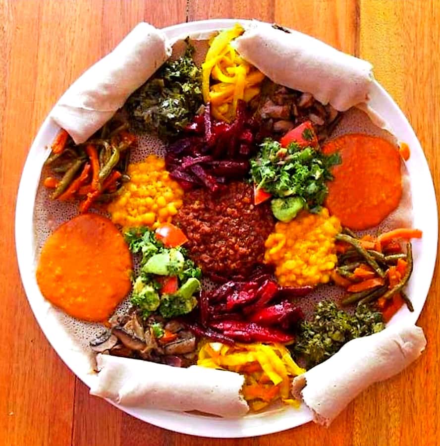 Food tour in Addis Ababa with airport pick-up. - Sitting down to bey ay netu and shiro wot